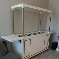 White wooden cart with canopy frame