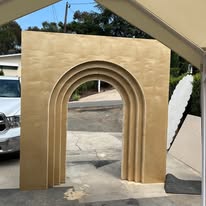 Triple arched wooden event backdrop