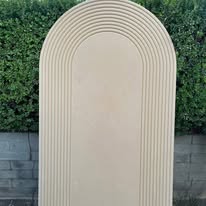 Ribbed wooden arch backdrop